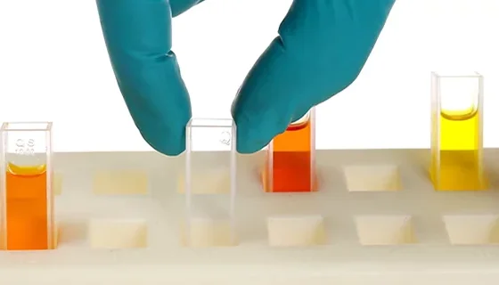 Precision measurements being performed with UV quartz cuvette for DNA analysis Precision measurements being performed with UV quartz cuvette for DNA analysis